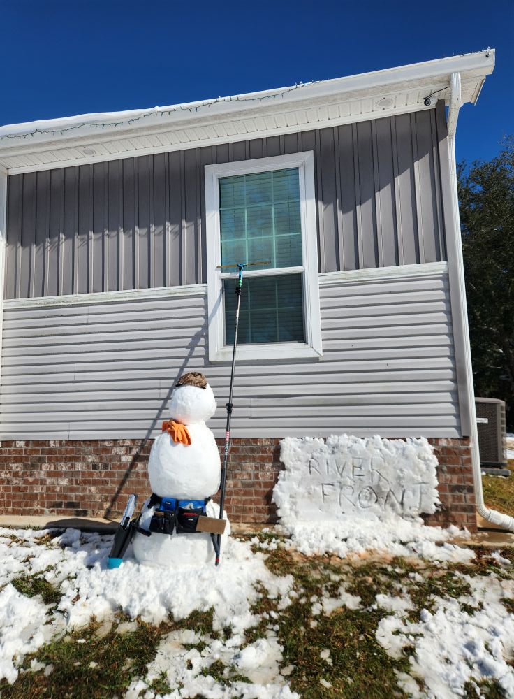 riverfront window clean funny image with snowman washing windowa after snow in covington